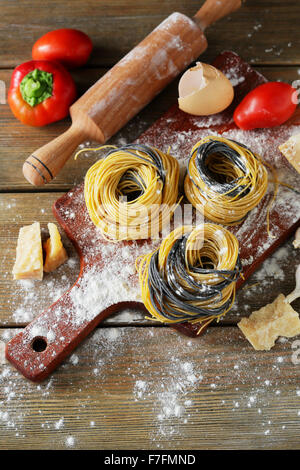 uncooked pasta on board, top view Stock Photo