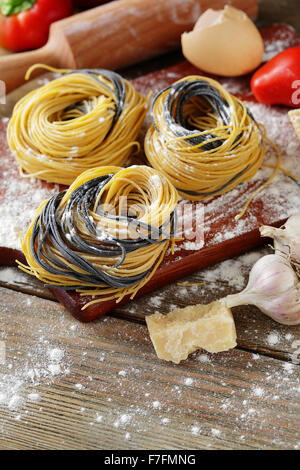 uncooked pasta with cooking ingredients, closeup Stock Photo