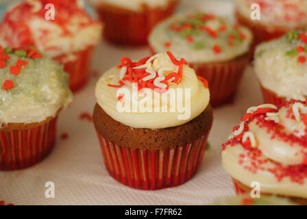 Homemade Christmas cupcakes with festive frosting and sprinkles Stock Photo