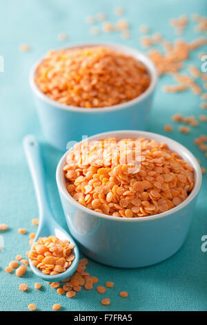 raw healthy red lentils in bowl Stock Photo