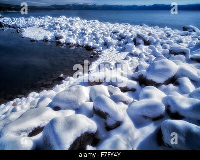 New snow on shore of Lake Tahoe, California Stock Photo