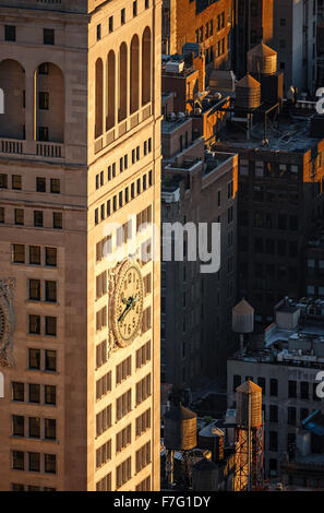 Aerial view of a New York City skyscraper at sunset with rooftop wooden water towers. Located on Madison Square Park, Manhattan Stock Photo