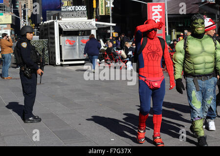 New York, NY, USA. 30th Nov, 2015. New York City, USA, 30 November 2015 ''“ The new Times Square, where panhandler-performers dressed like Elmo, Spider-Man, Lady Liberty and other characters descend on tourists hoping to get a bit of their cash. Some have complained that the costumed super-heroes are overly aggressive in their solicitations ''” and downright nasty when they are turned down. They have been many arrests. Junior Bishop, 25, was arrested on 28 July 2014 dressed as Spiderman and once again, was arrested today, this time dressed as the Hulk for aggressive pan Stock Photo