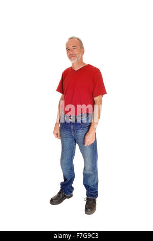 A middle age male in a red t-shirt standing isolated for white background and looking angry. Stock Photo