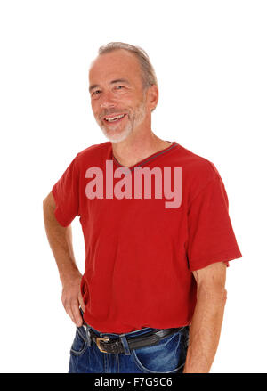 A middle age male in a red t-shirt standing isolated for white background and smiling. Stock Photo