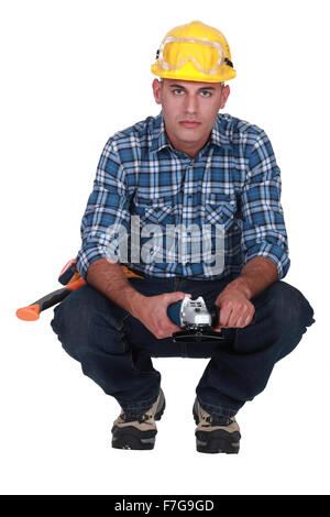 Builder with angle grinder Stock Photo