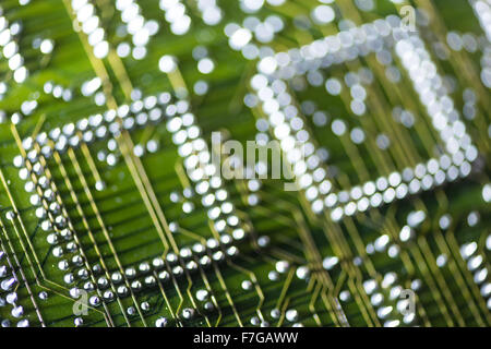 rows of soldered electrical components on circuit board showing solder connections computing motherboard Stock Photo