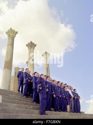 Members of the Moroccan Airforce pose for a group portrait at Volubilis; Roman ruins in the Meknes Province in Northern Morocco. Stock Photo