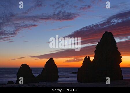 Sunset at Rodeo Beach in the Marin Headlands, California, with crescent moon Stock Photo