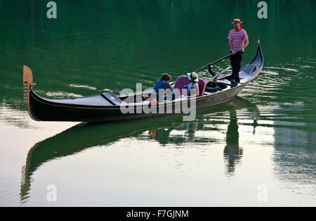 NEW YORK, NY - JUNE 27: Gondolier at the lake in Central park on June 27, 2008 in New York, NY. Central park is the biggest city Stock Photo