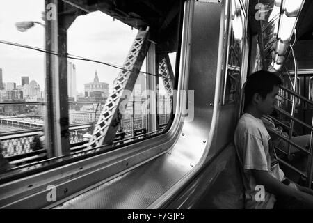 NEW YORK - JUNE 24: New York subway car interior while crossing Manhattan bridge, June 24nd, 2008 in NY, USA Stock Photo