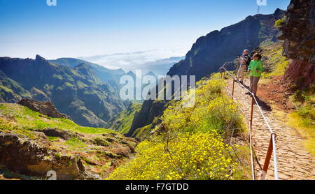 Tourists on hiking trail from  Pico do Arieiro to Pico Ruivo, Madeira island, Portugal Stock Photo