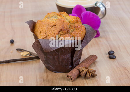 Muffin with coffee served bright orchid Stock Photo - Alamy