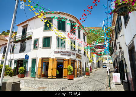 Street decorated with paper flowers on feast of Madeira, Camara de Lobos, Madeira, Portugal Stock Photo