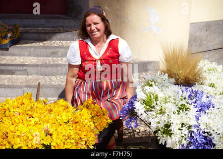 Flowers seller in Funchal market, Madeira, Portugal Stock Photo