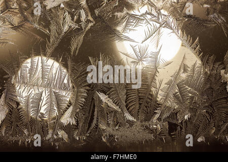 Rime on window and christmas light on background Stock Photo