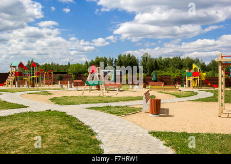 children's playground with swings and slides countryside Stock Photo