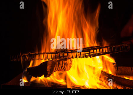 empty grill rack on fire burning in brazier Stock Photo