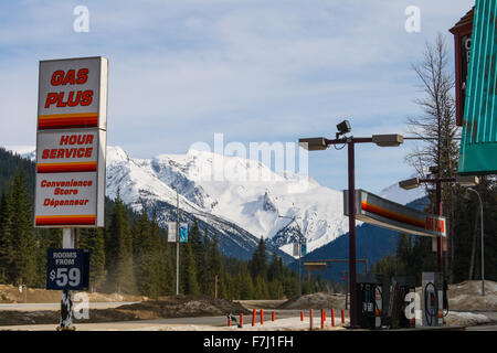 Gas plus at Rogers Pass British Columbia, Canada snow on the mountains clear at the fuel station. Stock Photo