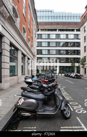 Scooters and motorbikes parked in a Solo Motorcycles bay in a side street near the BBC, London, England, UK Stock Photo