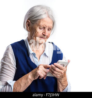 Senior woman using smartphone over white Stock Photo