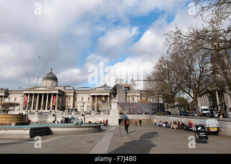 People walking about in Trafalgar Square, London, England, UK Stock Photo