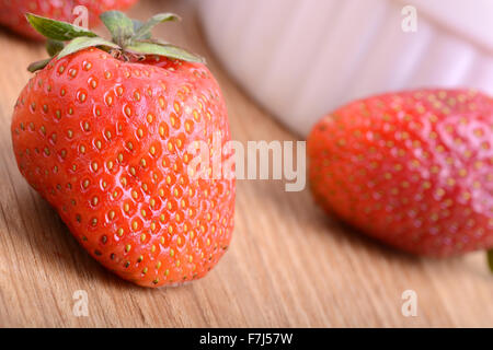 Strawberry set on wooden plate close up Stock Photo