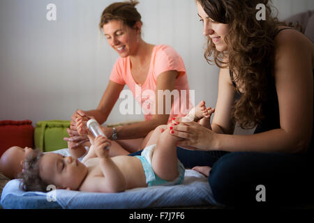 INFANT BEING MASSAGED Stock Photo