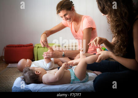 INFANT BEING MASSAGED Stock Photo