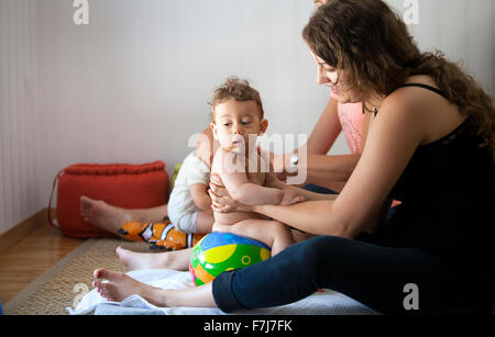 INFANT BEING MASSAGED Stock Photo