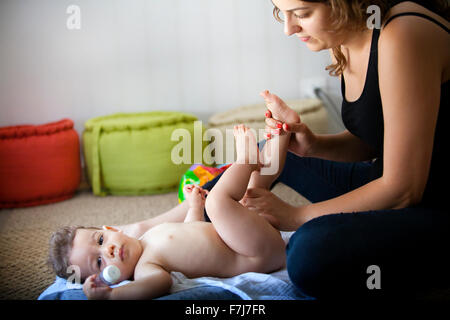 INFANT BEING MASSAGED Stock Photo