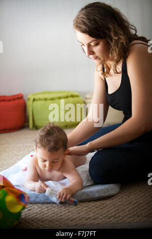 INFANT BEING MASSAGED Stock Photo