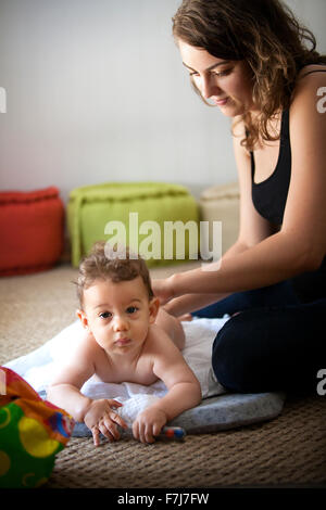 INFANT BEING MASSAGED Stock Photo