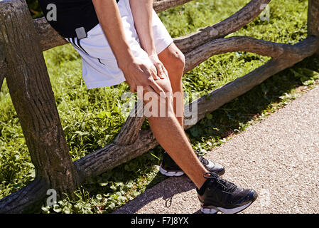 MAN WITH KNEE PAIN Stock Photo