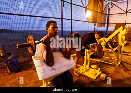 Strength Training on the beach at night mood in outdoor training center on the beach promenade in Iquique Chile Stock Photo