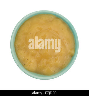 Top view of a green bowl with chicken flavored gravy isolated on a white background. Stock Photo