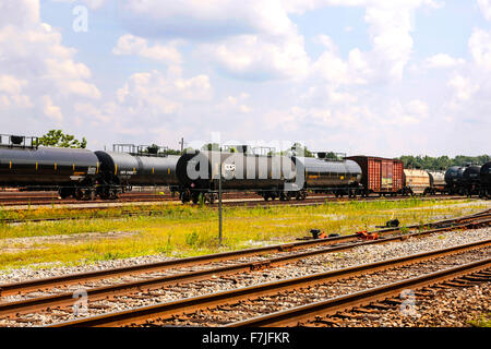 Oil tanker and freight carriages at the Hattiesburg Mississippi Amtrak railway yard Stock Photo