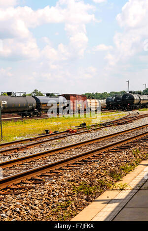 Oil tanker and freight carriages at the Hattiesburg Mississippi Amtrak railway yard Stock Photo