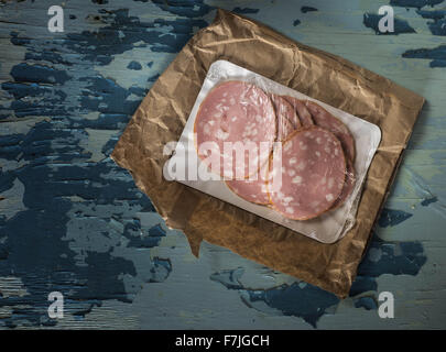 Nov. 25, 2015 - Mortadella on old weathering painted table © Igor Goiovniov/ZUMA Wire/Ģ����ý Live News Stock Photo