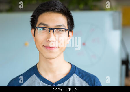 Portrait of handsome attractive young asian male in glasses Stock Photo