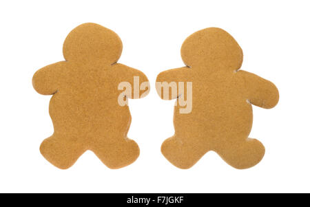 Two unfrosted gingerbread men Christmas cookies side by side on a white background. Stock Photo