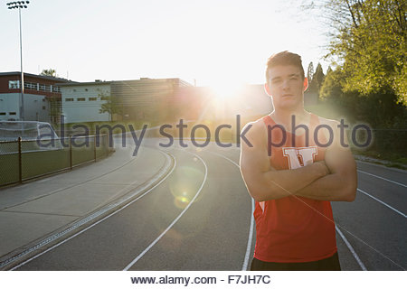 Portrait confident high school track and field athlete