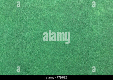 A very close view of the texture of a new green kitchen scrubber. Stock Photo