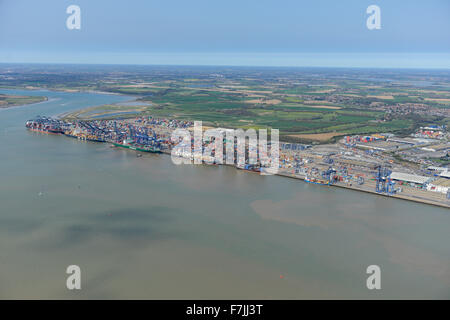 A wide view from Harwich Harbour looking over towards Felixstowe Docks and the Trimley Marshes behind. Stock Photo