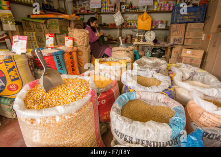 Shop selling various types of corn and grain in town of Cajabamba in Cajamarca region of Peru Stock Photo