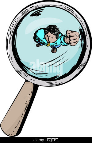 Angry man under a magnifying glass with clenched fist Stock Photo