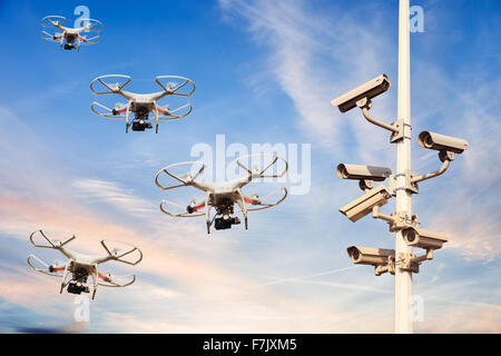 Many drones flying against the blue sky. Stock Photo
