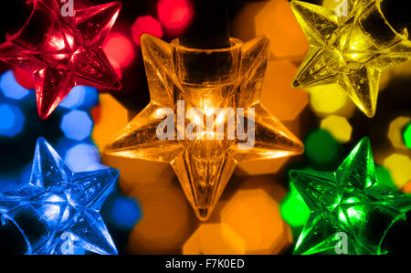 Macro shot of star shaped festive lights.Christmas fairy lights Stock Photo