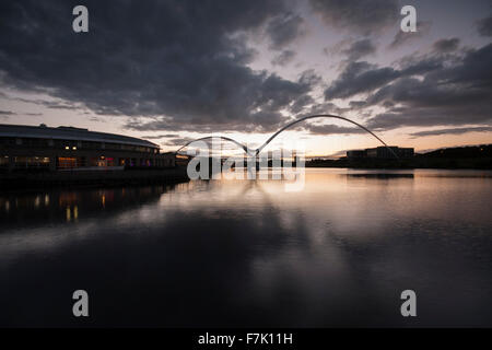 View of Infinity Bridge at dusk time in the borough of Stockton-on-Tees,north east England,UK showing dark,foreboding skies Stock Photo