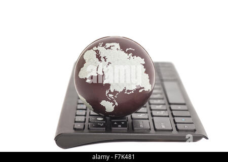 Earth on keyboard isolated on white Stock Photo
